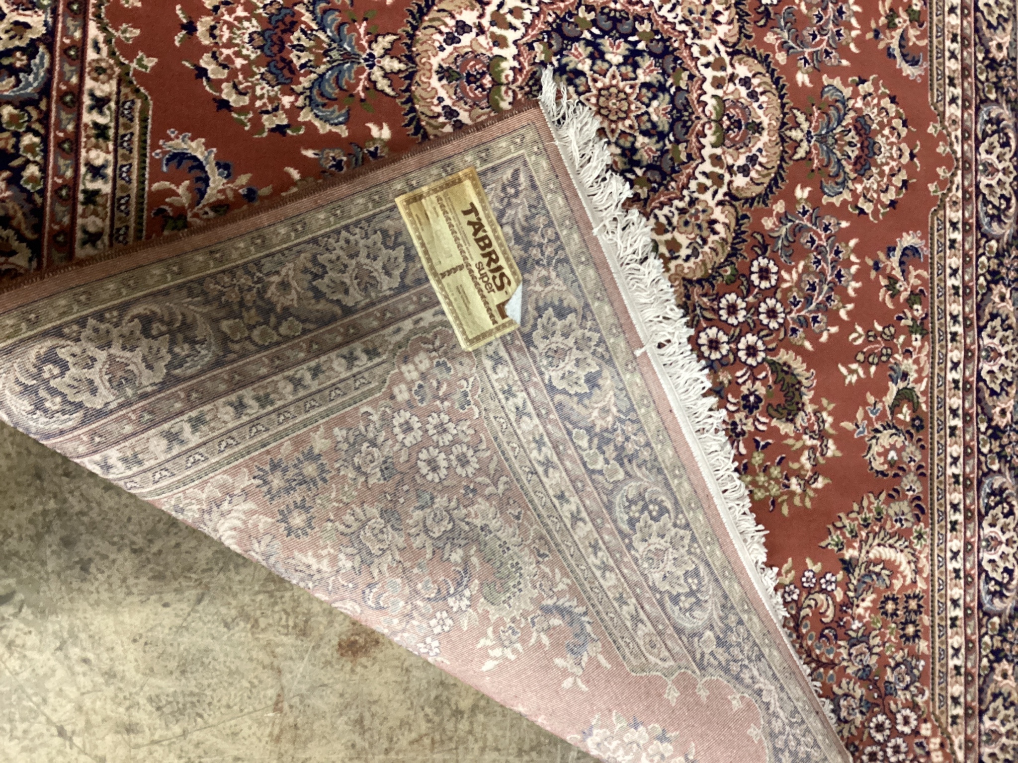 A modern Tabriz style red ground rug, 240 x 162cm